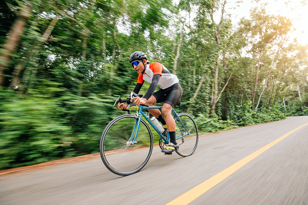 Professional athelete, cycling fast-paced downhill.